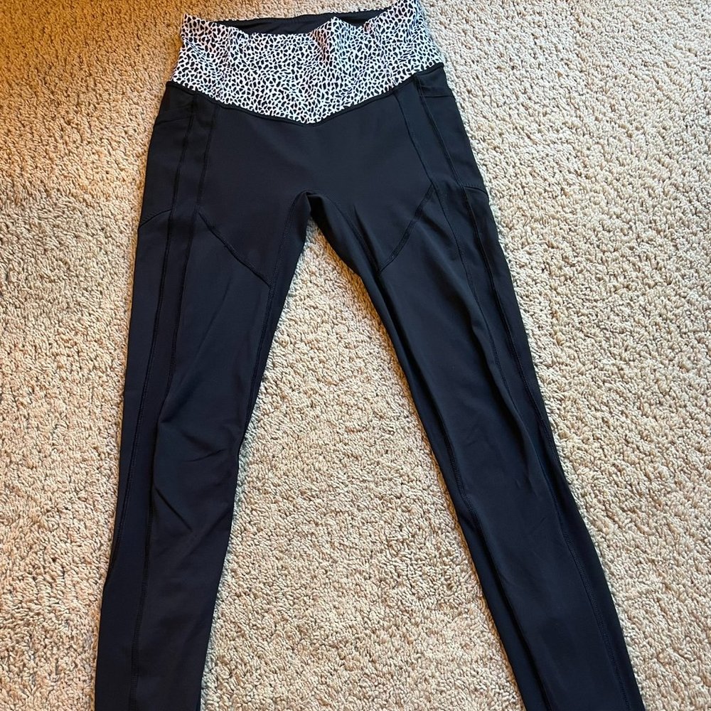 Lululemon women's tights. Black with black/white patterned waistband. Size 6.